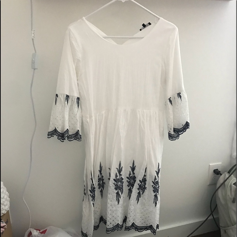 White dress with blue detail